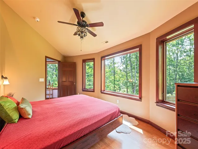 a bedroom with a large bed and a window