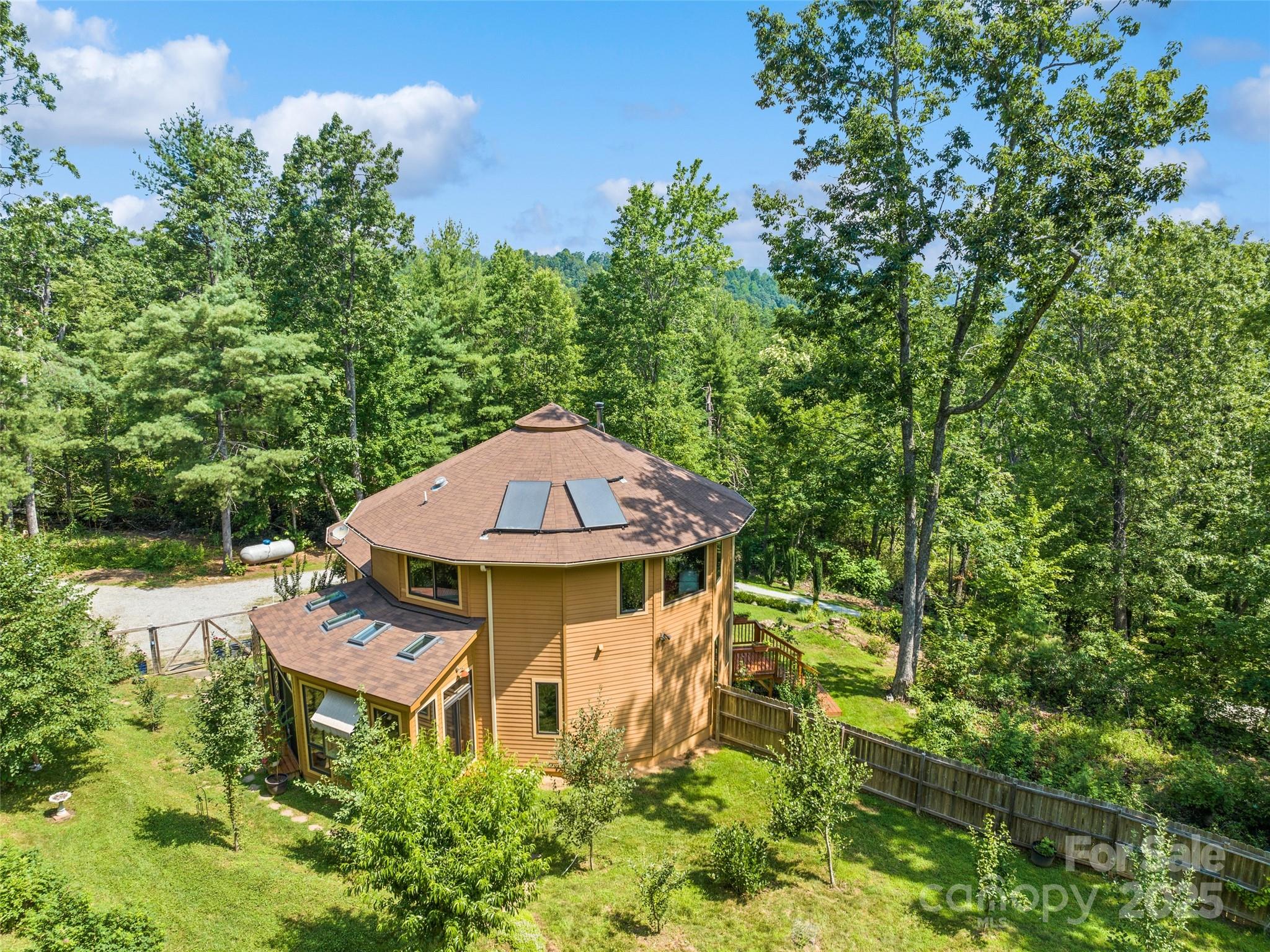 2675 Holbert Cove Road Saluda, NC 28773 - Photo 4 of 48 an aerial view of a house with swimming pool and garden