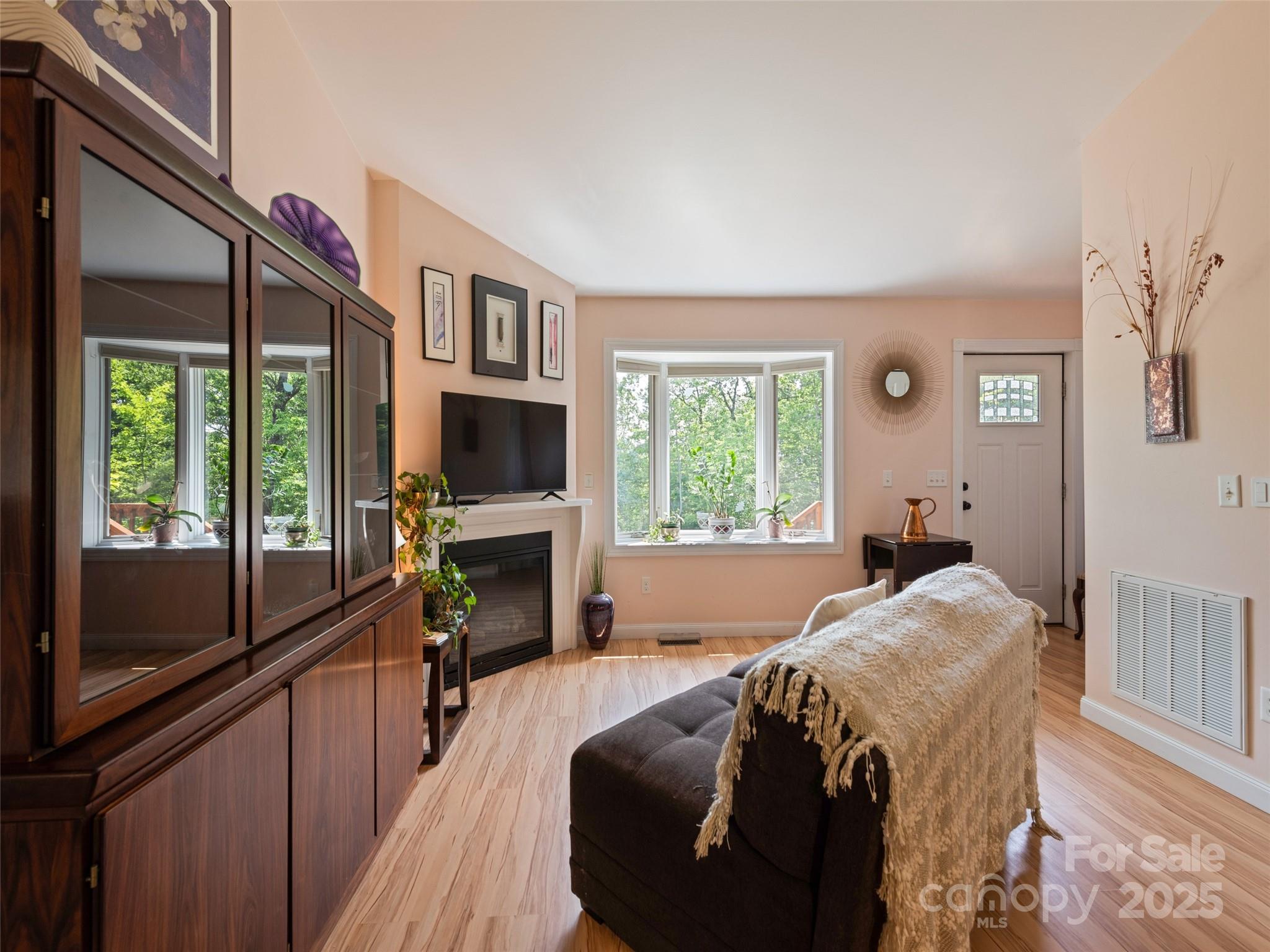 2675 Holbert Cove Road Saluda, NC 28773 - Photo 43 of 48 a bedroom with a bed and a flat screen tv