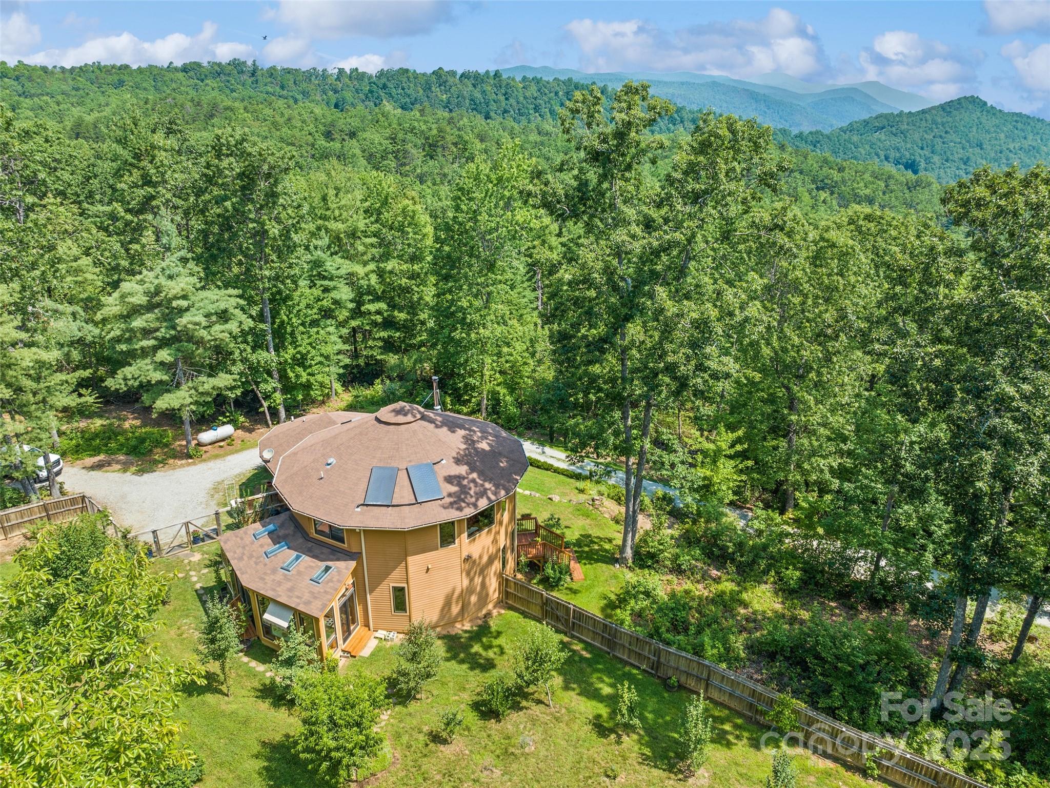 2675 Holbert Cove Road Saluda, NC 28773 - Photo 6 of 48 an aerial view of a house with garden space and street view