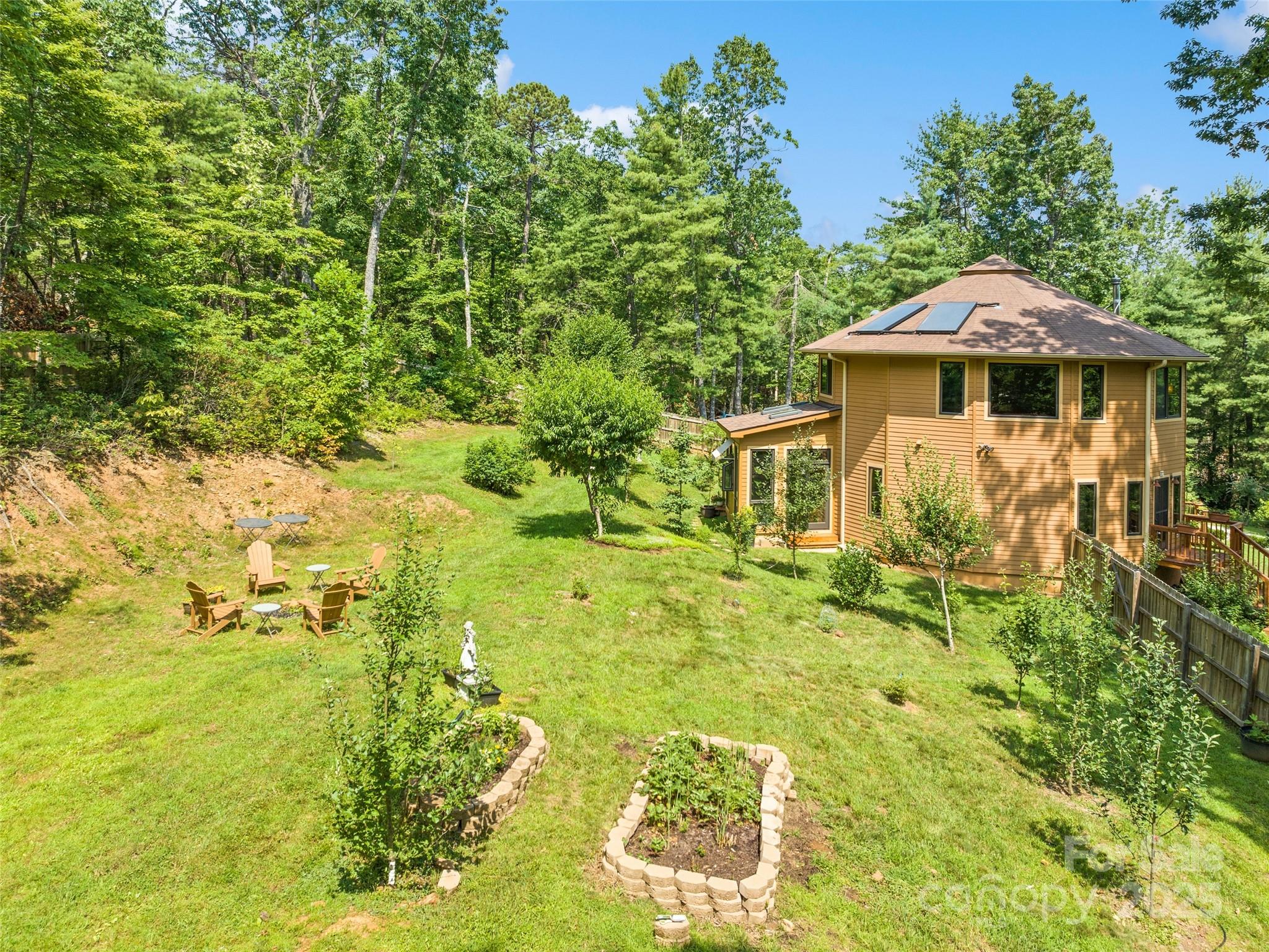 2675 Holbert Cove Road Saluda, NC 28773 - Photo 8 of 48 a yellow house with trees in front of it