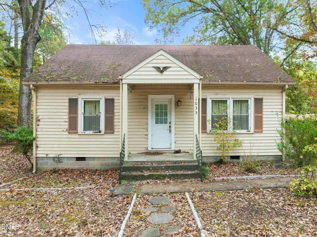a front view of a house with yard