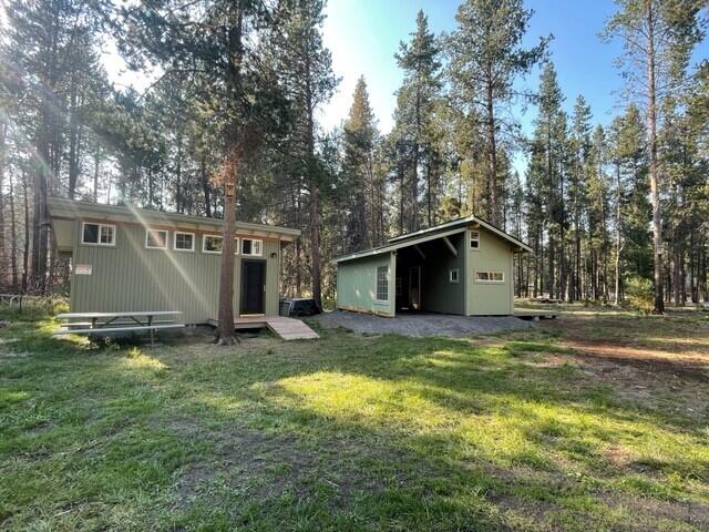 16868 Hermosa Road Bend, OR 97707 - Photo 13 of 40 a view of a house with a yard and garage