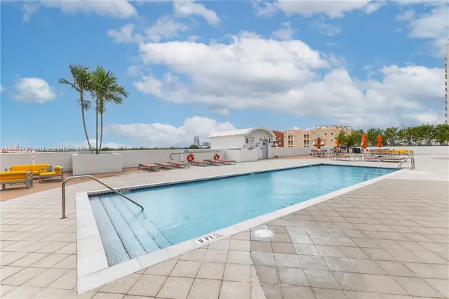 a view of a dinning table and chairs in patio