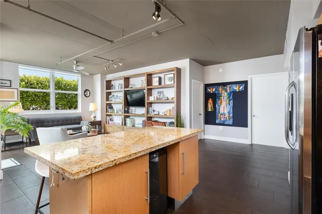 a kitchen with a sink a counter top space and a window