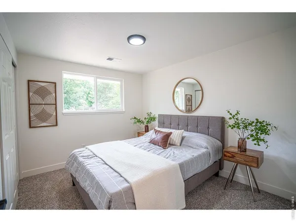 a bedroom with a bed and a table in it