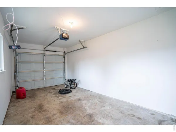 a view of a room with air conditioner and a window