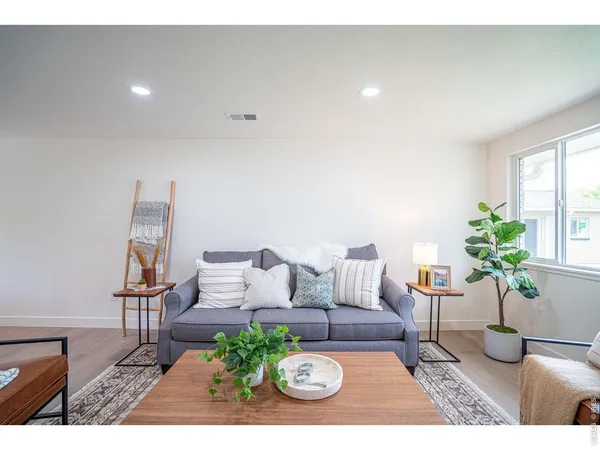 a living room with furniture and a table