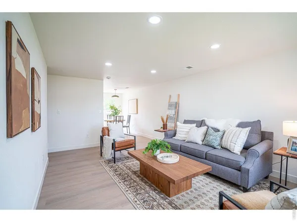 a living room with furniture and a rug