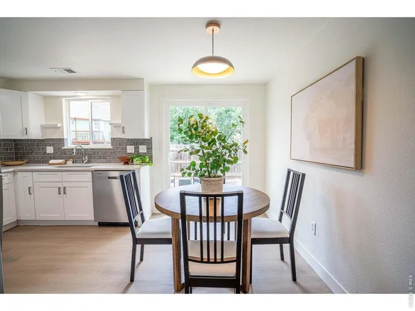 a view of a dining room with furniture window and outside view
