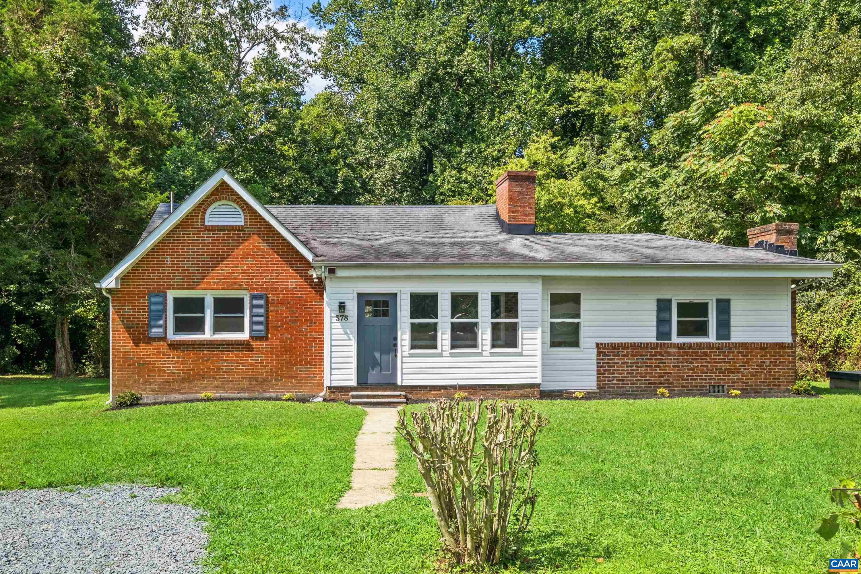 578 Maxfield Road Keswick, VA 22947 - Photo 1 of 39 a front view of a house with yard and green space