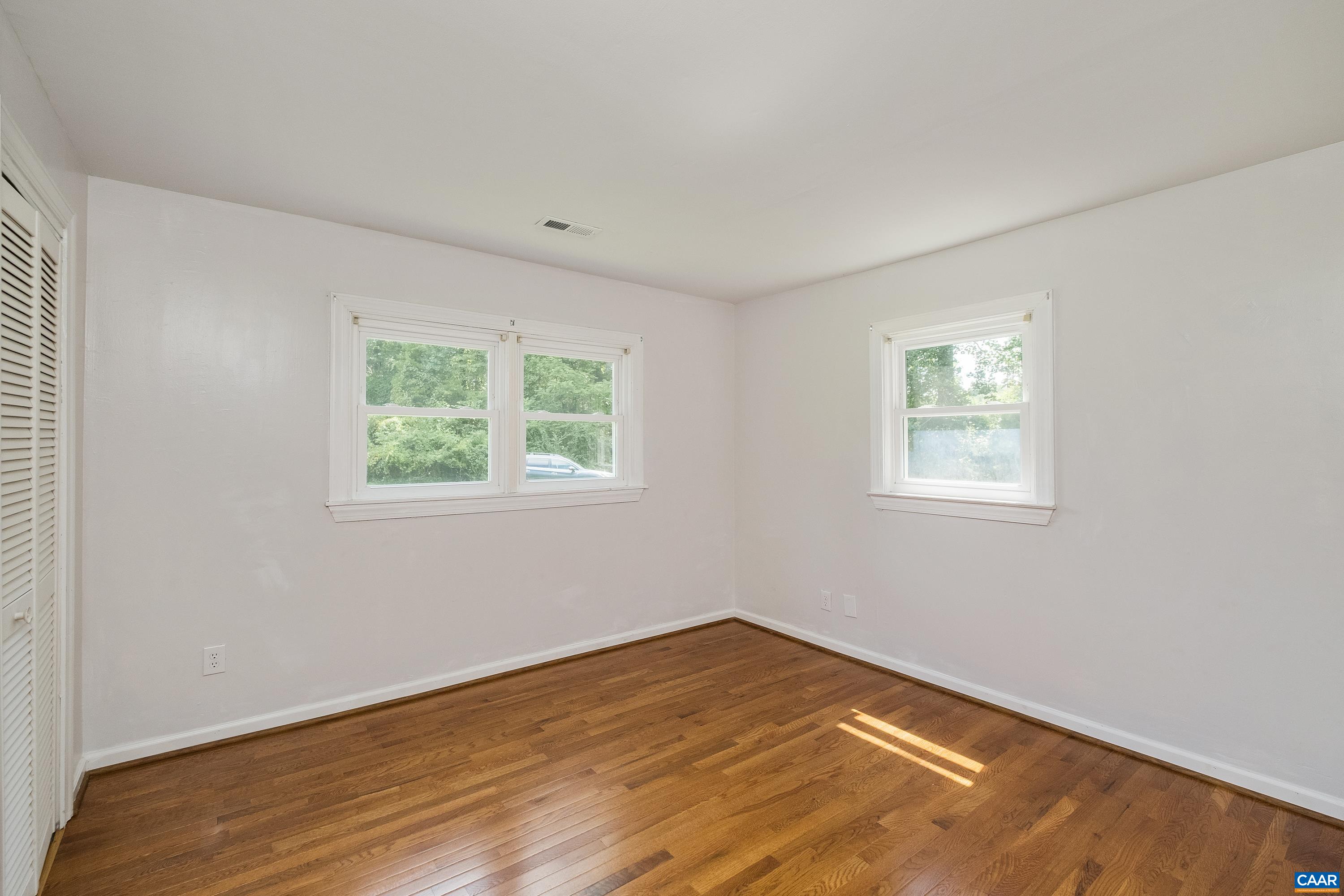 578 Maxfield Road Keswick, VA 22947 - Photo 19 of 39 a view of a room with wooden floor and windows