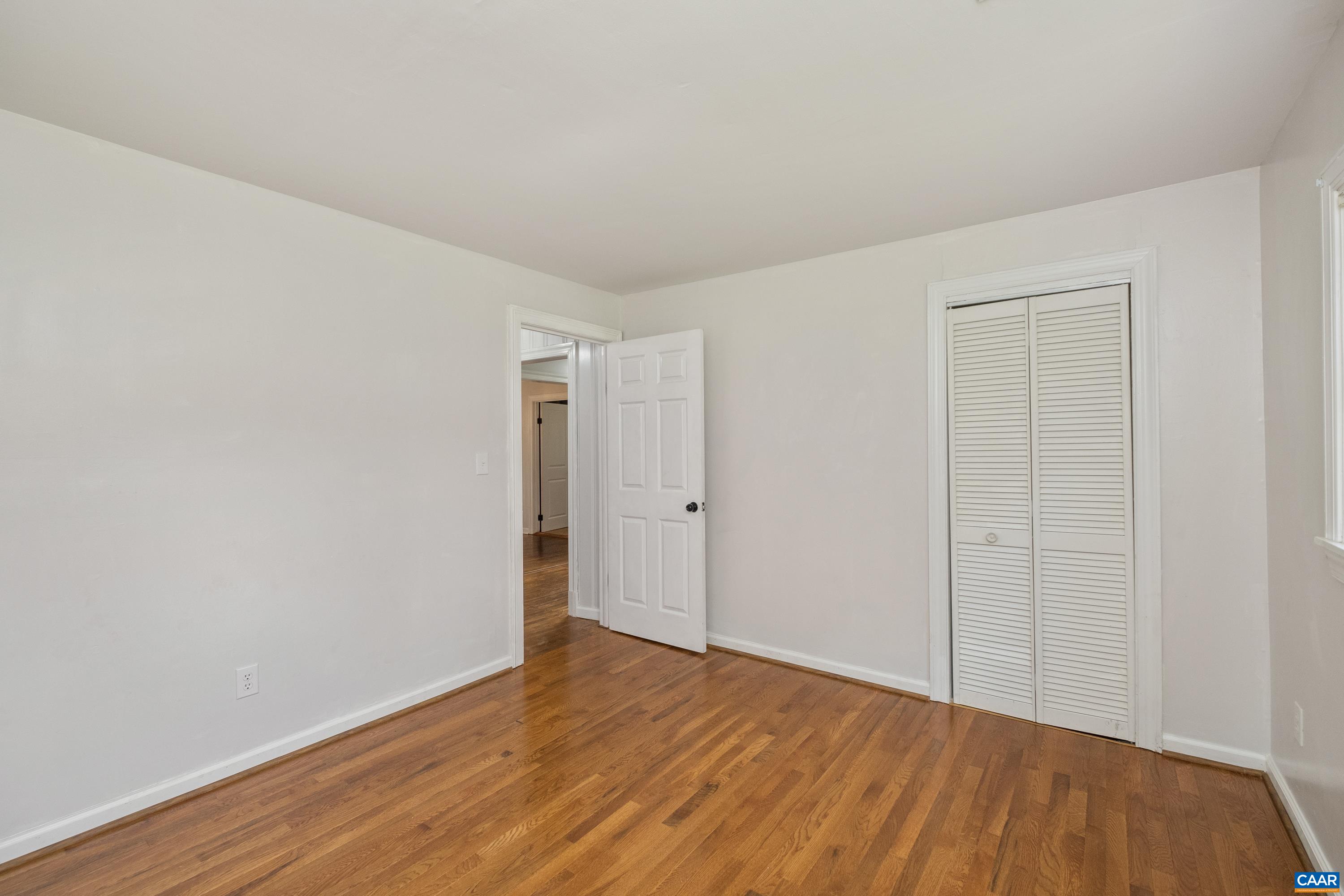578 Maxfield Road Keswick, VA 22947 - Photo 20 of 39 a view of an empty room with wooden floor