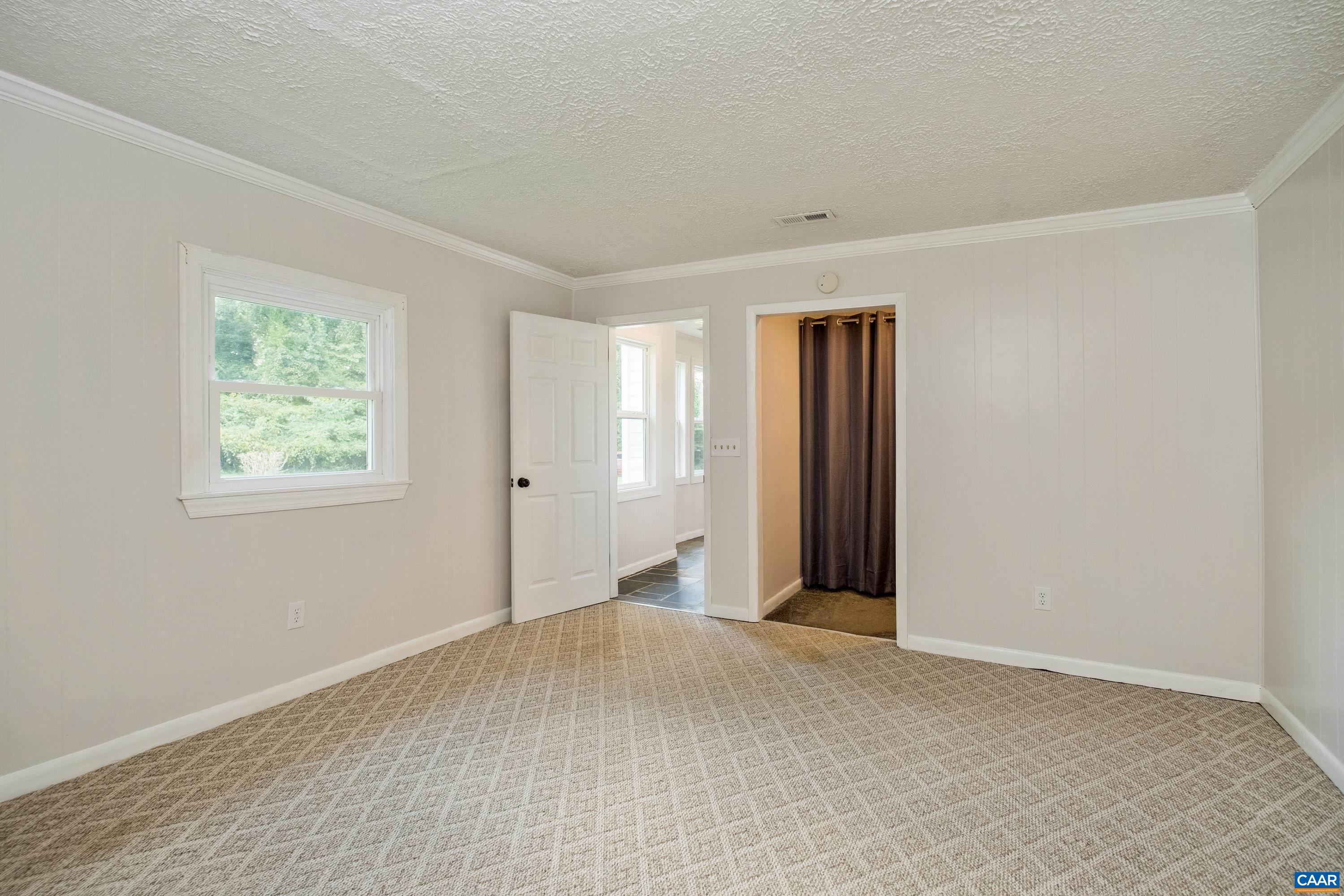 578 Maxfield Road Keswick, VA 22947 - Photo 24 of 39 a view of an empty room with closet and a window