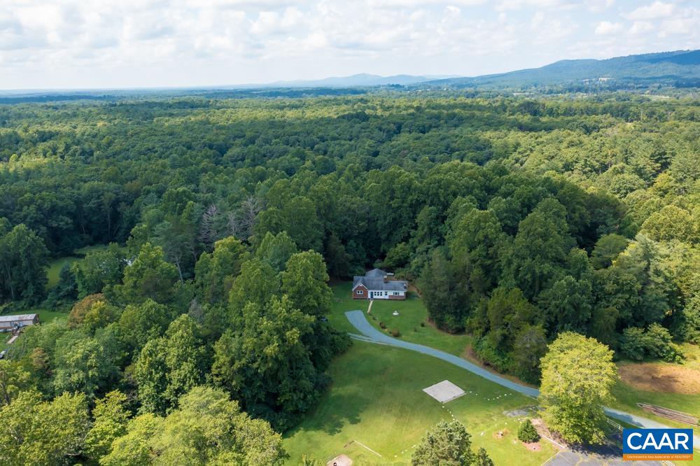 578 Maxfield Road Keswick, VA 22947 - Photo 32 of 39 a view of a city with lush green forest