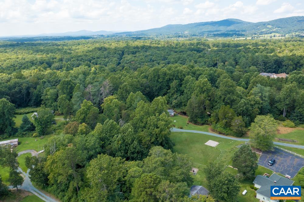 578 Maxfield Road Keswick, VA 22947 - Photo 35 of 39 a view of a lush green hillside and a houses