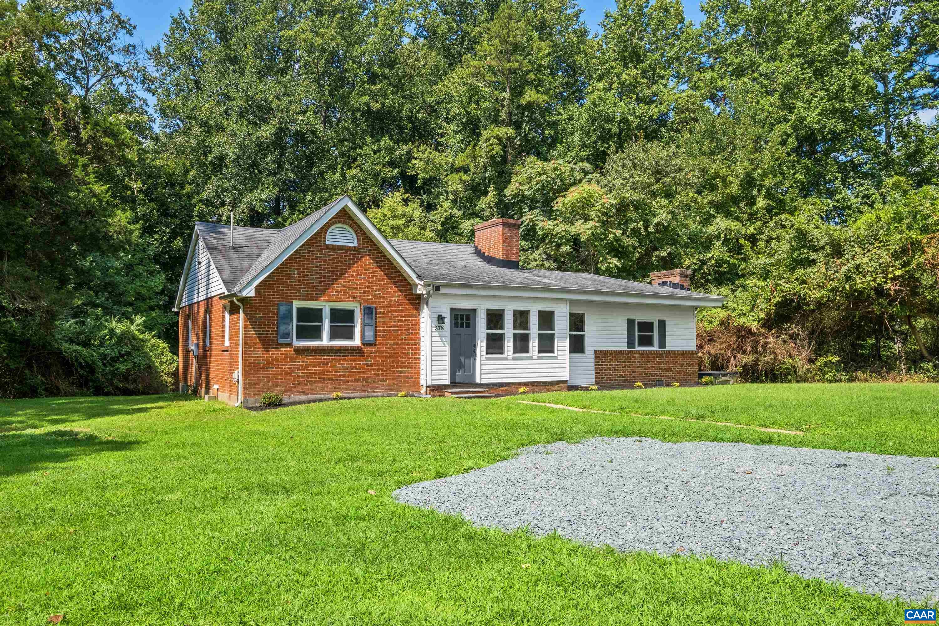 578 Maxfield Road Keswick, VA 22947 - Photo 4 of 39 a front view of a house with a yard and trees
