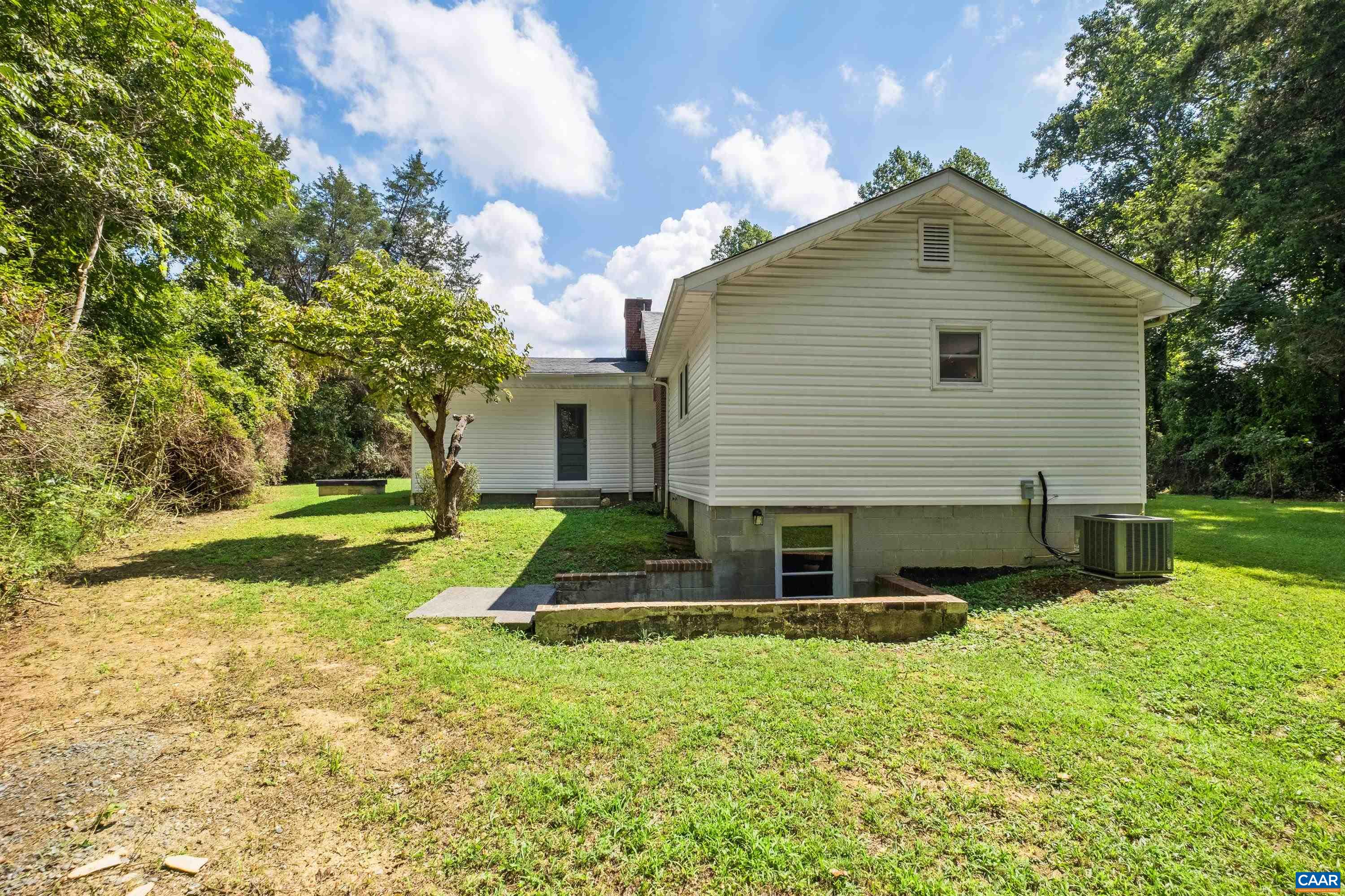 578 Maxfield Road Keswick, VA 22947 - Photo 6 of 39 front view of a house with a yard