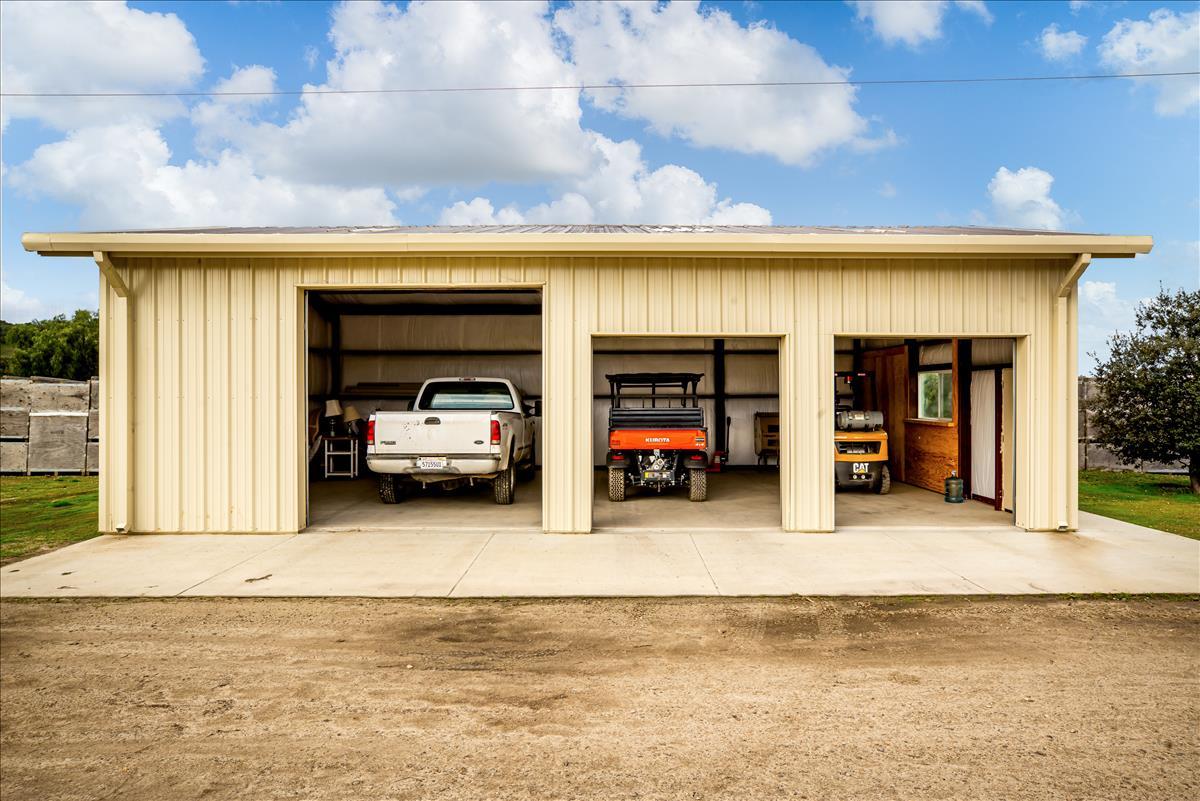 4892 Hapgood Road Lompoc, CA 93436 - Photo 21 of 32 a view of a car garage with a car parked and car parked