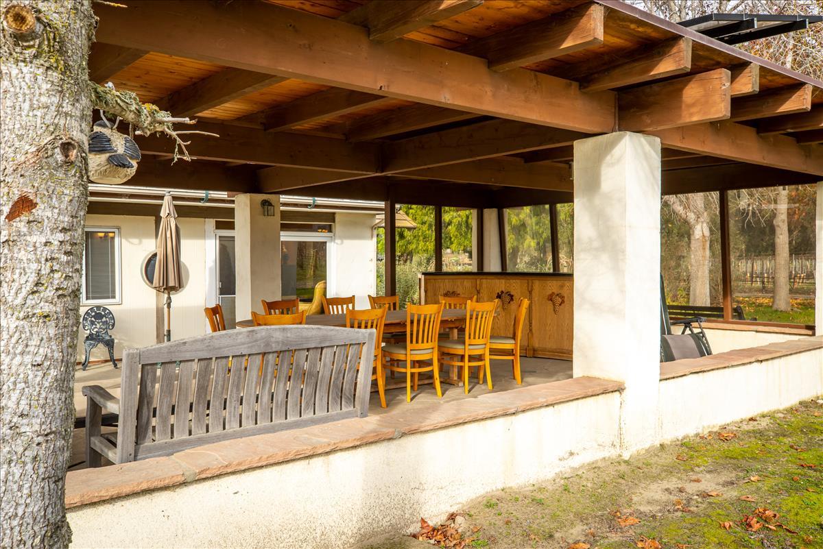 4892 Hapgood Road Lompoc, CA 93436 - Photo 23 of 32 a view of a chairs and table in a patio