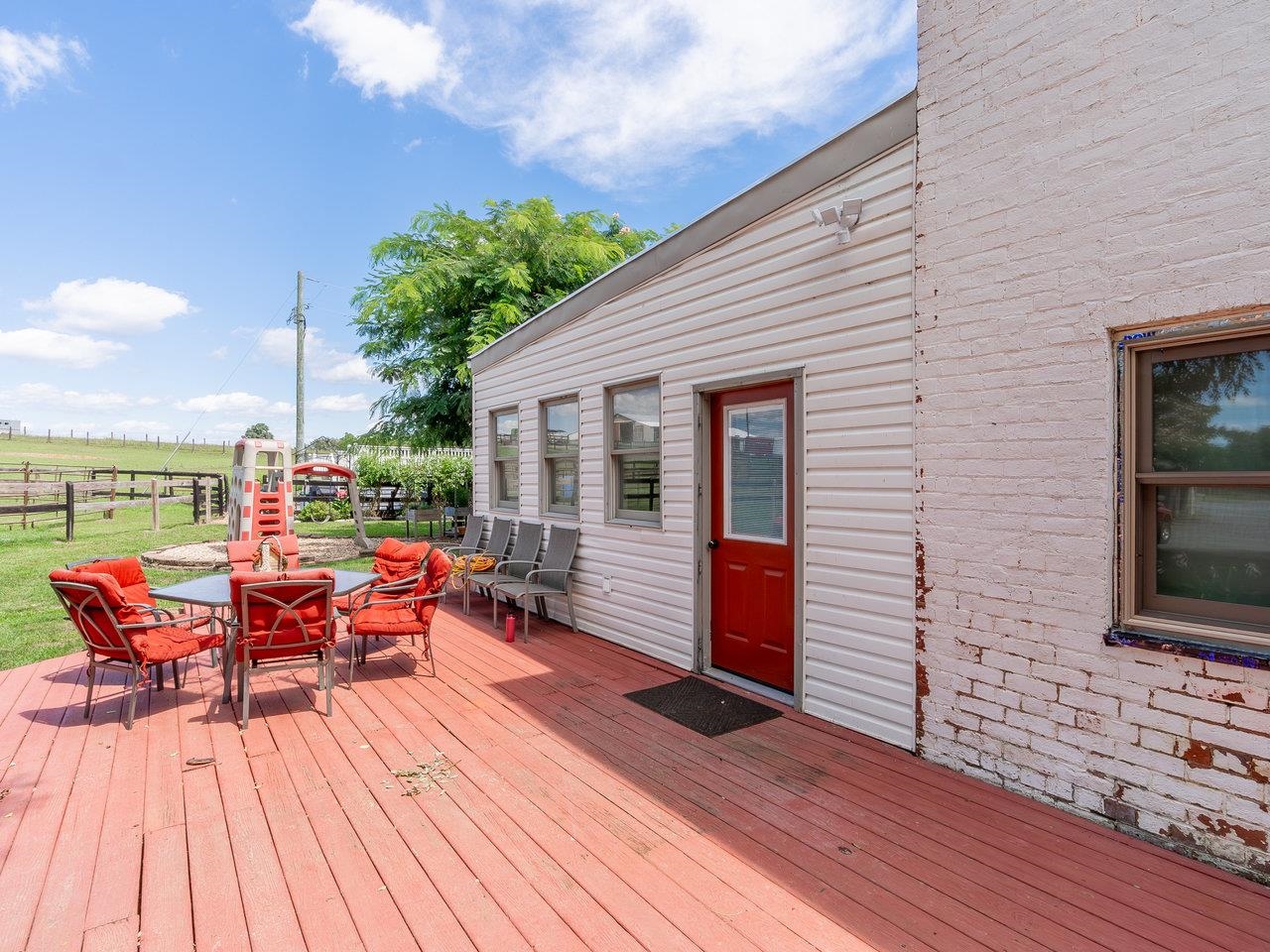 1299 North River Road Mount Crawford, VA 22841 - Photo 12 of 75 a balcony with wooden floor table and chairs