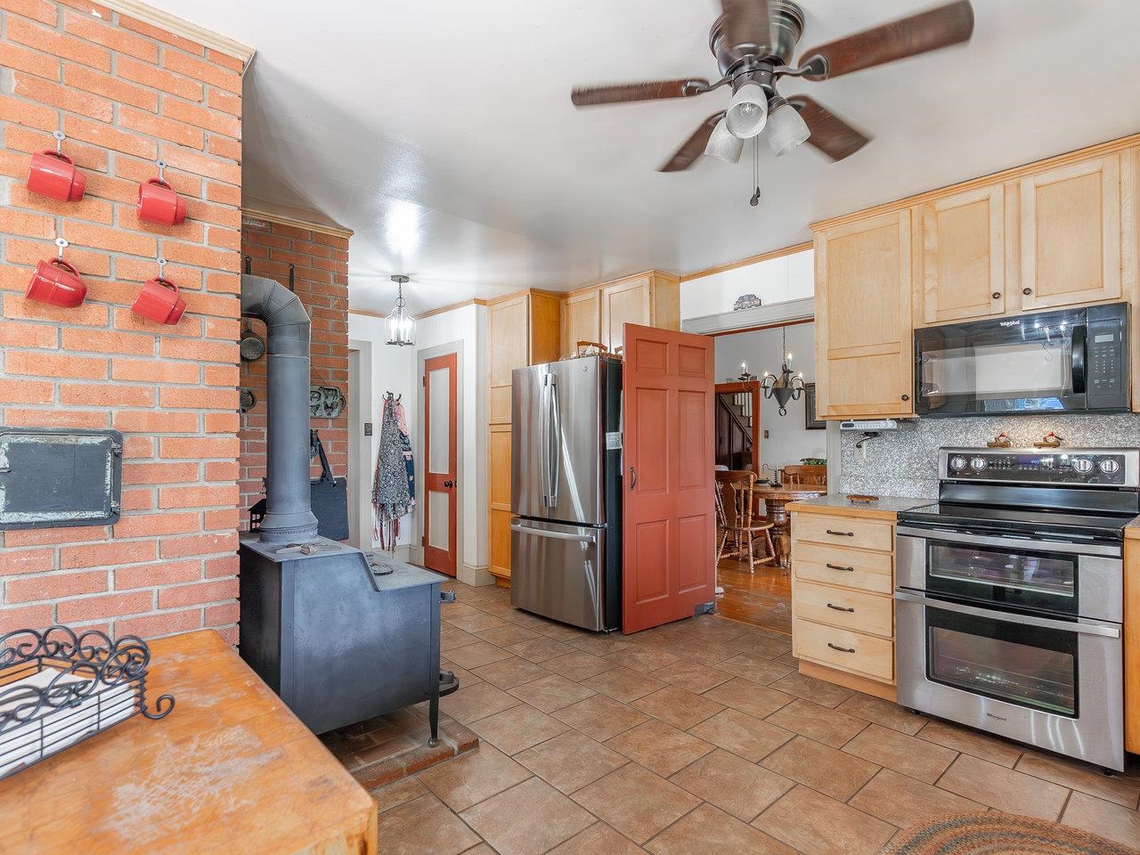 1299 North River Road Mount Crawford, VA 22841 - Photo 18 of 75 a kitchen with stainless steel appliances kitchen island granite countertop a refrigerator and a stove top oven
