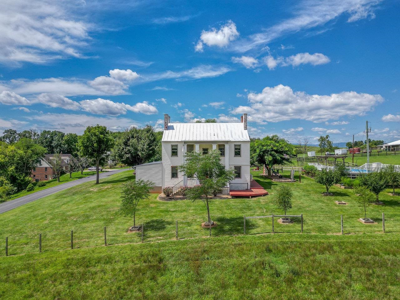 1299 North River Road Mount Crawford, VA 22841 - Photo 3 of 75 a view of a house with a big yard and potted plants