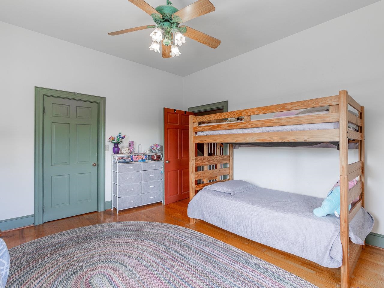 1299 North River Road Mount Crawford, VA 22841 - Photo 42 of 75 a bedroom with a bed and a chandelier