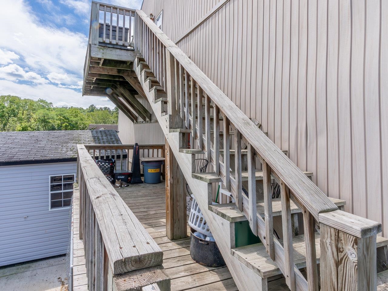 1299 North River Road Mount Crawford, VA 22841 - Photo 58 of 75 a balcony of a house with wooden floor and stairs