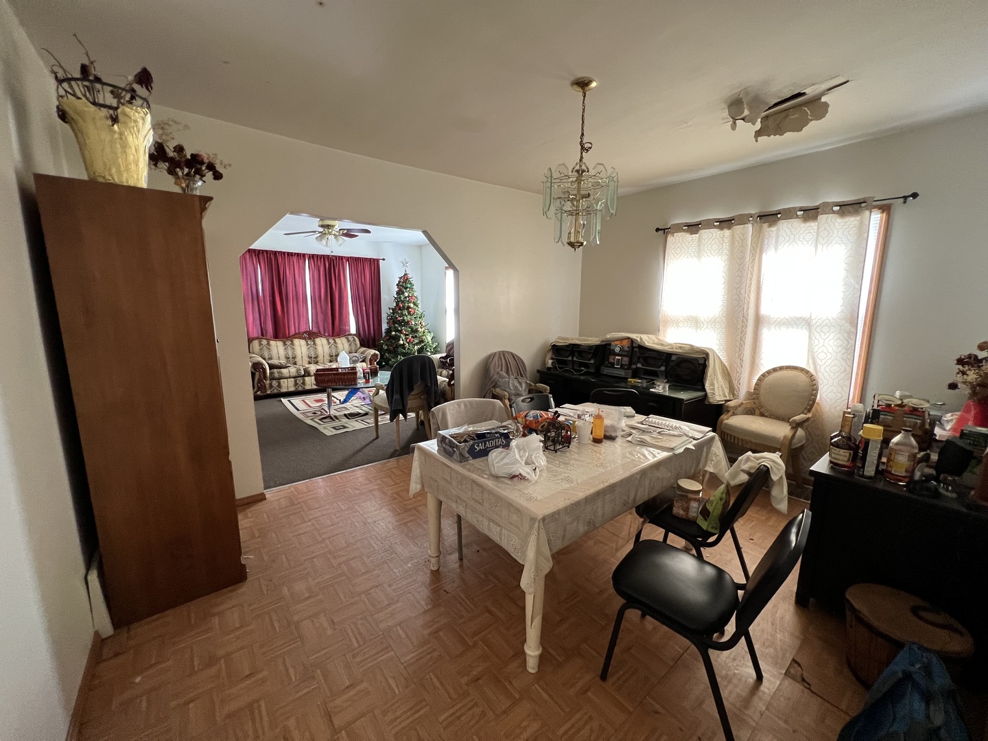 7501 West 58th Street Summit, IL 60501 - Photo 4 of 8 a living room with furniture and a chandelier