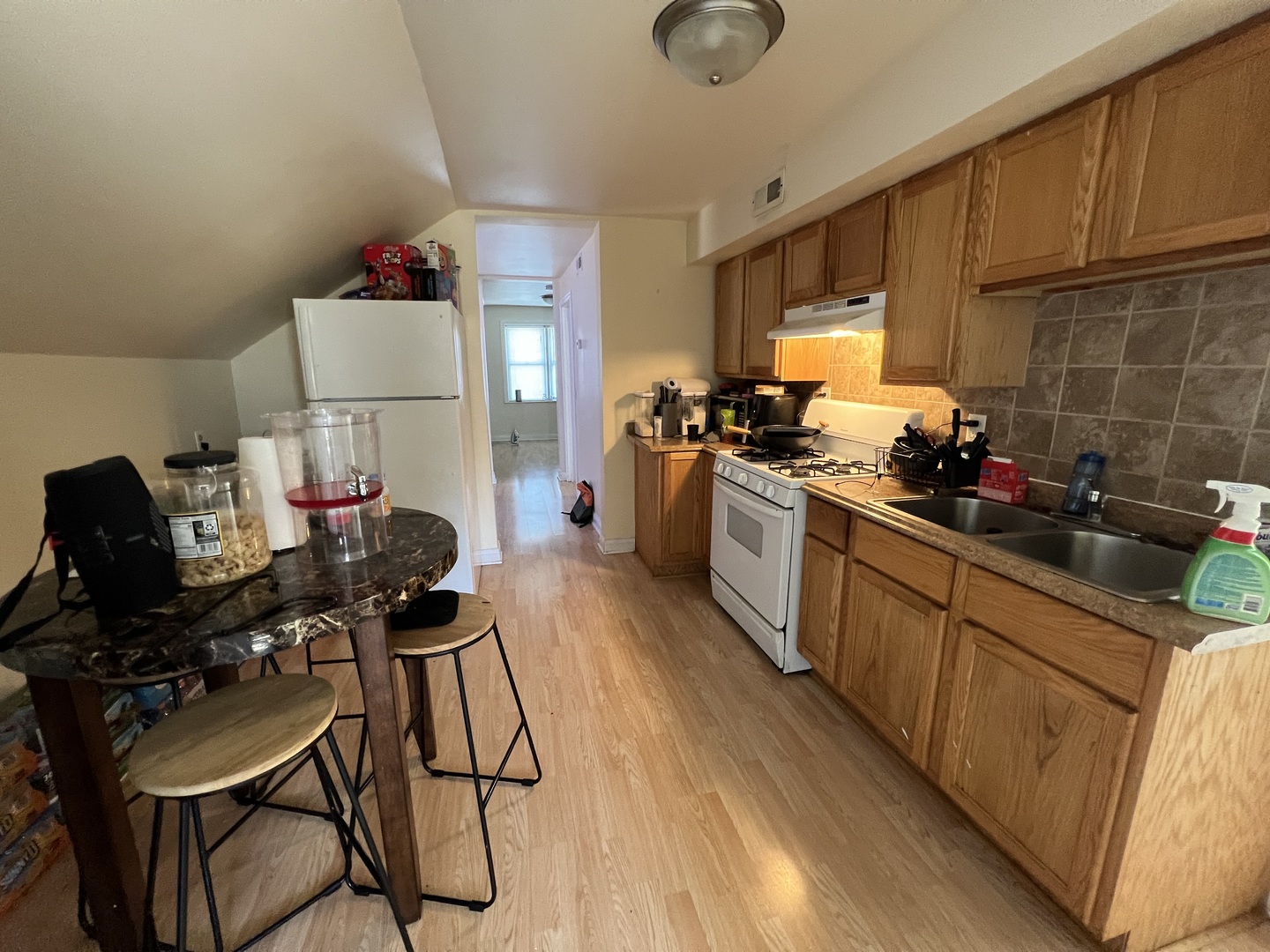7501 West 58th Street Summit, IL 60501 - Photo 5 of 8 a kitchen with a sink appliances and cabinets