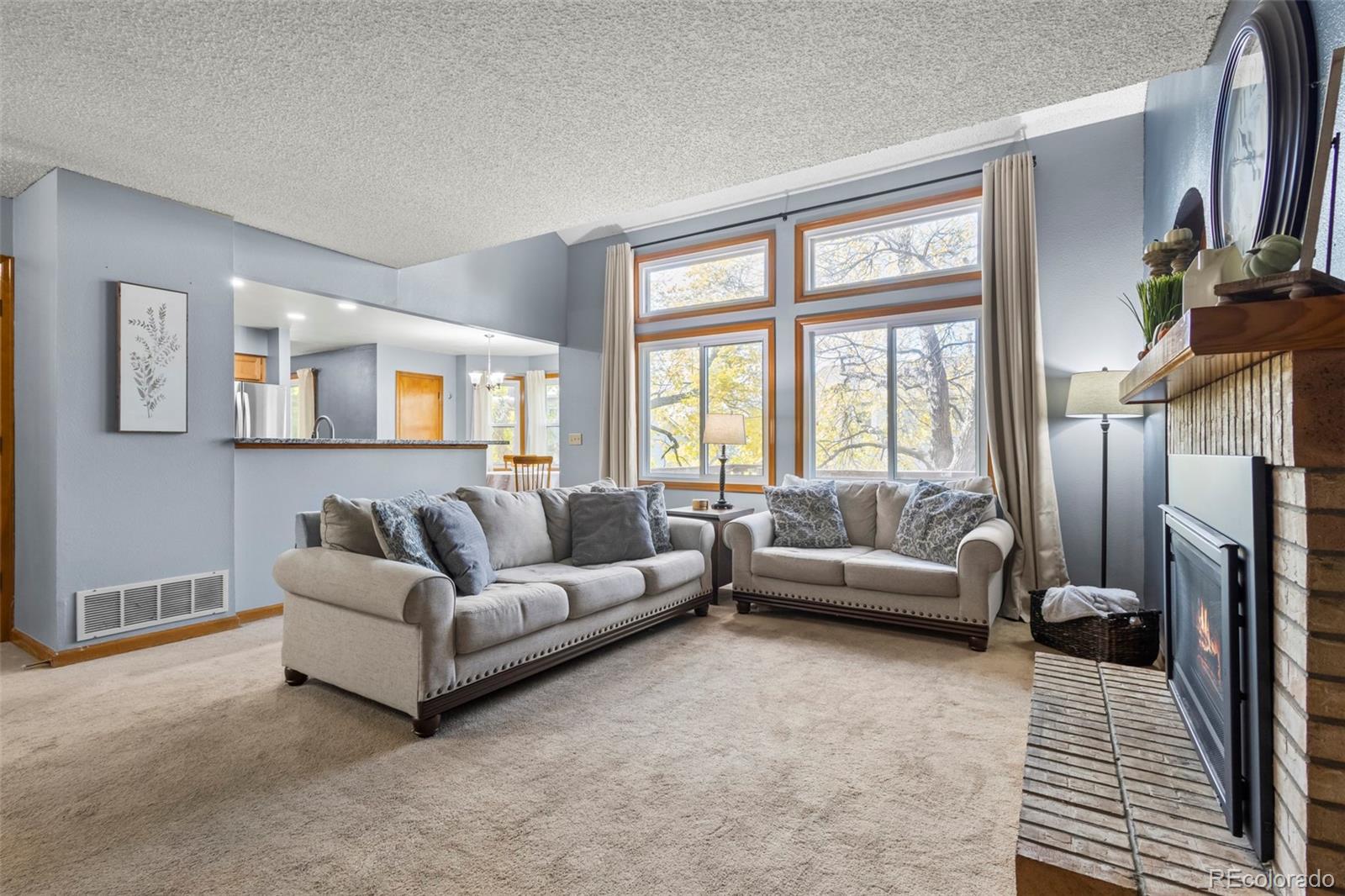 17538 East Baker Place Aurora, CO 80013 - Photo 18 of 50 a living room with furniture and a large window