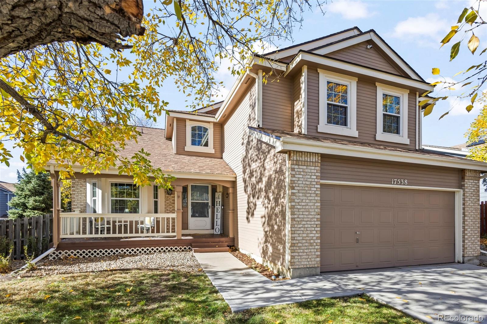 17538 East Baker Place Aurora, CO 80013 - Photo 2 of 50 a front view of a house with a yard