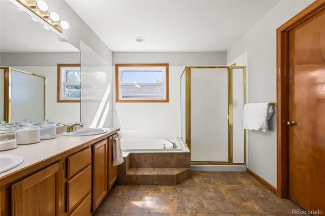 a spacious bathroom with a sink and a mirror