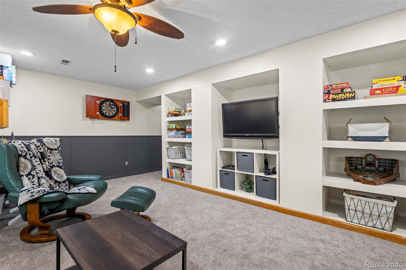 17538 East Baker Place Aurora, CO 80013 - Photo 35 of 50 a living room with furniture and a flat screen tv