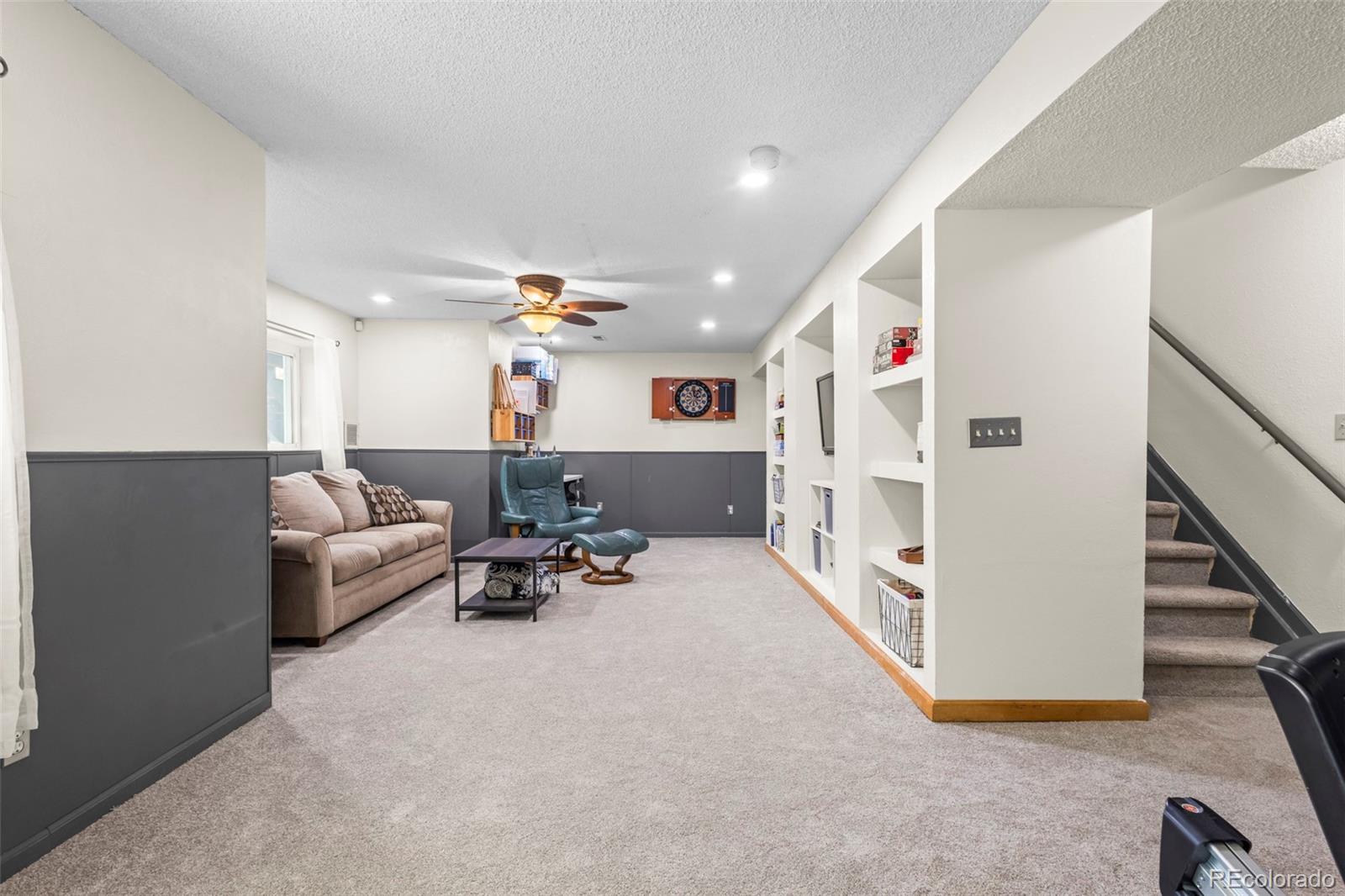 17538 East Baker Place Aurora, CO 80013 - Photo 36 of 50 a living room with furniture and a chandelier