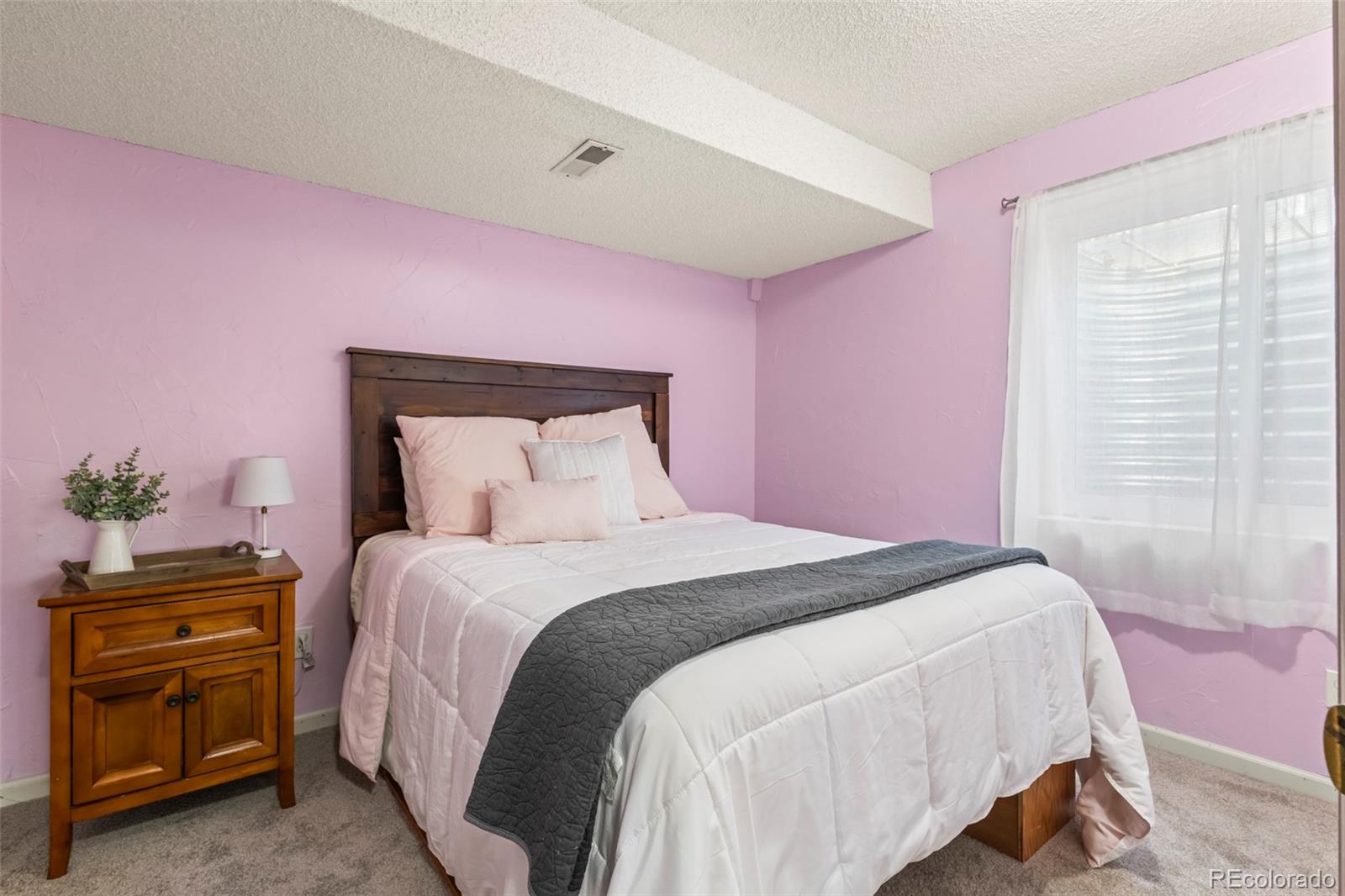 17538 East Baker Place Aurora, CO 80013 - Photo 37 of 50 a bedroom with a bed and a dresser