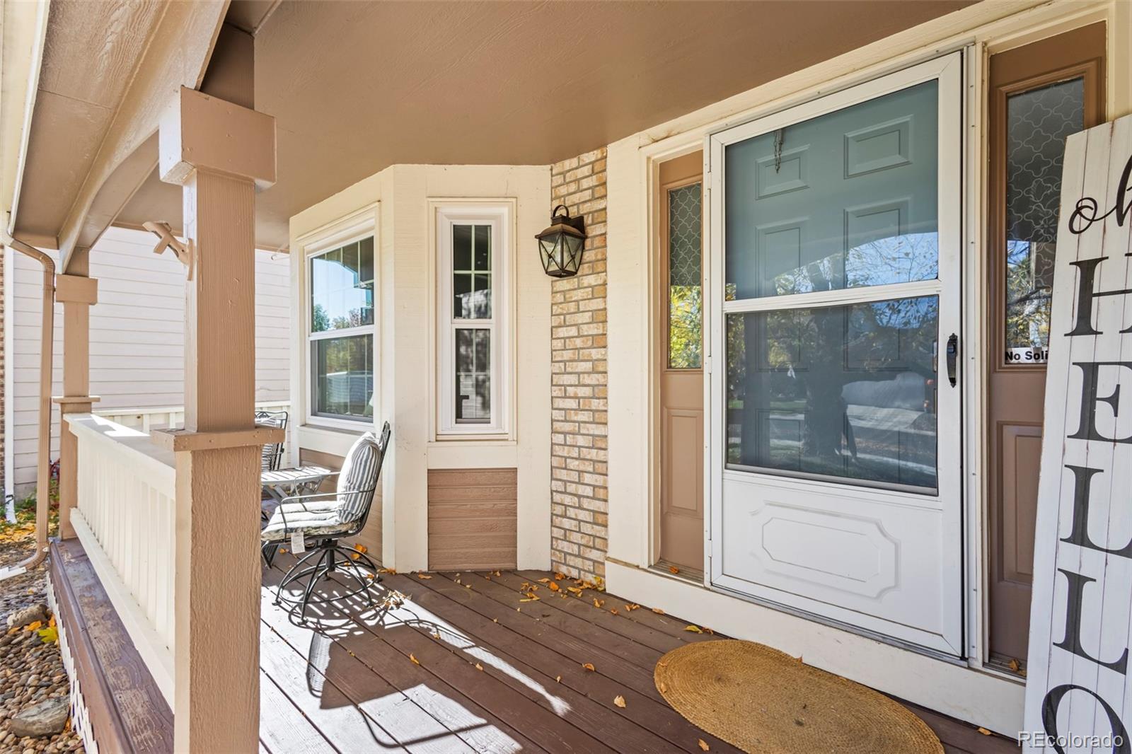 17538 East Baker Place Aurora, CO 80013 - Photo 4 of 50 a living room with a balcony a rug and a window