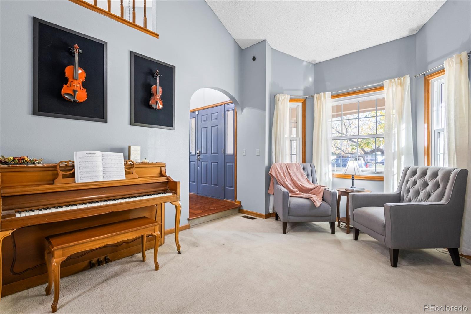 17538 East Baker Place Aurora, CO 80013 - Photo 7 of 50 a living room with furniture a flat screen tv and a window