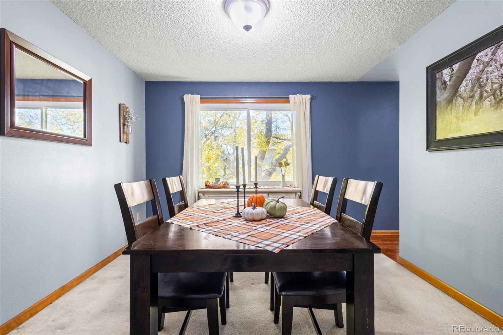 17538 East Baker Place Aurora, CO 80013 - Photo 8 of 50 a view of a dining room with furniture window and wooden floor