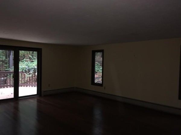 76 Proctor Road Townsend, MA 01469 - Photo 12 of 30 a view of an empty room with wooden floor and a window