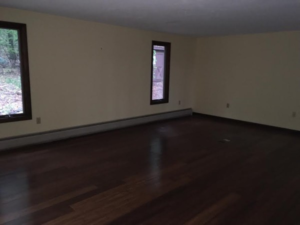 76 Proctor Road Townsend, MA 01469 - Photo 13 of 30 a view of an empty room with wooden floor and a window