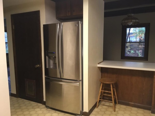76 Proctor Road Townsend, MA 01469 - Photo 9 of 30 a metallic refrigerator freezer sitting in a kitchen