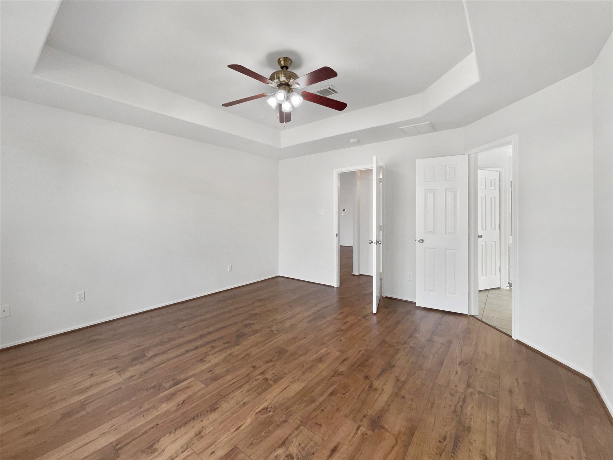 18810 Appletree Ridge Road Houston, TX 77084 - Photo 11 of 24 a view of an empty room with wooden floor