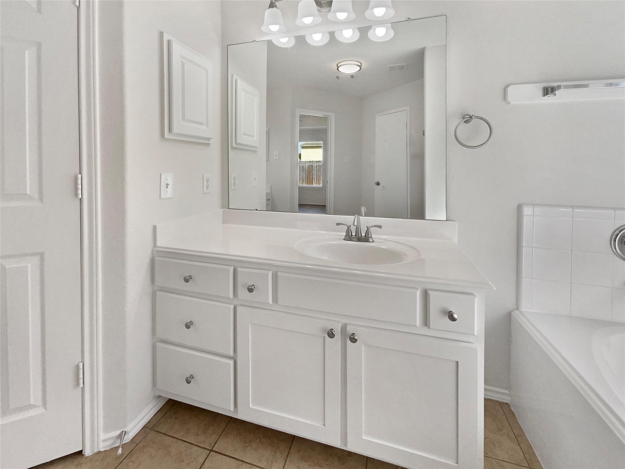18810 Appletree Ridge Road Houston, TX 77084 - Photo 17 of 24 a bathroom with a sink vanity and mirror
