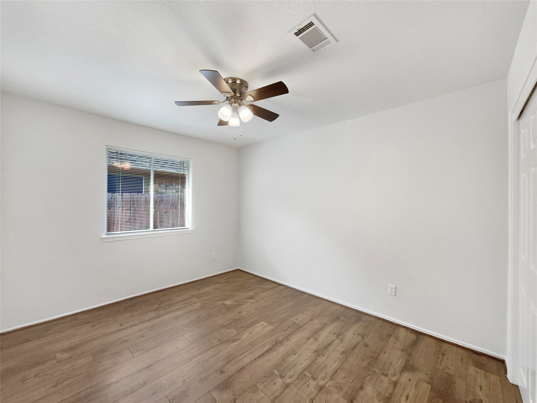 18810 Appletree Ridge Road Houston, TX 77084 - Photo 20 of 24 an empty room with a window and ceiling fan