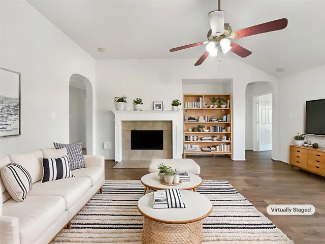 a living room with furniture and a fireplace
