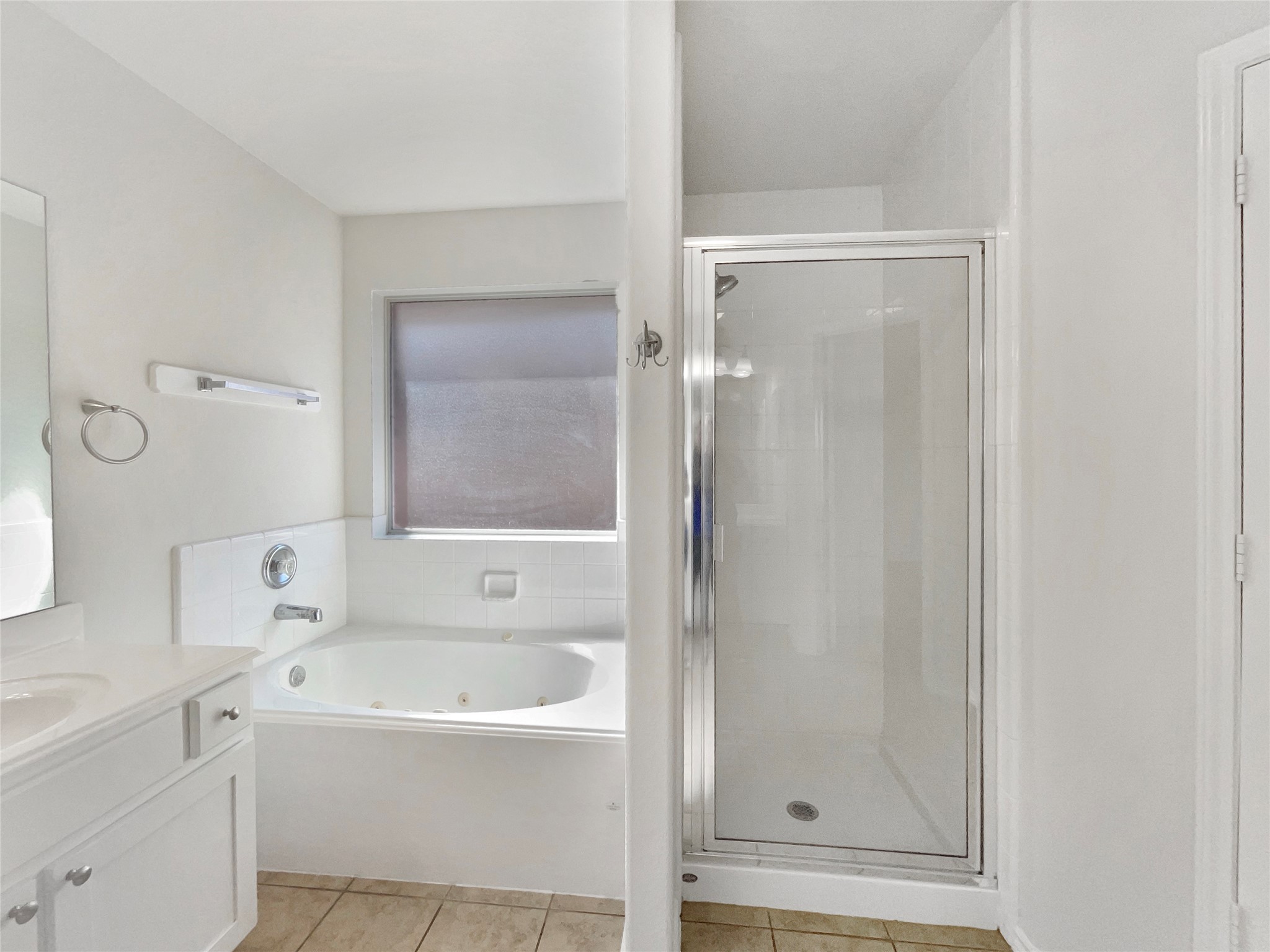 18810 Appletree Ridge Road Houston, TX 77084 - Photo 7 of 24 a bathroom with a bathtub and a shower