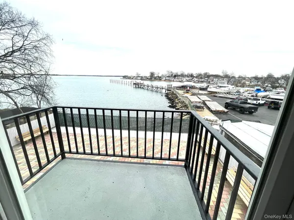 a view of a balcony with wooden floor