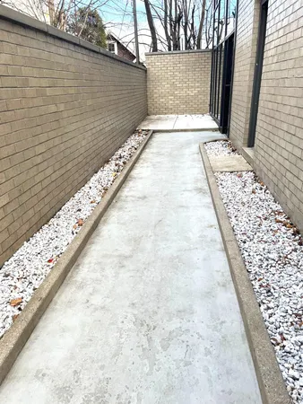 a view of a bathroom with a shower and a sink